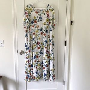 A beautiful floral dress, you will need a slip under as it is sheer.